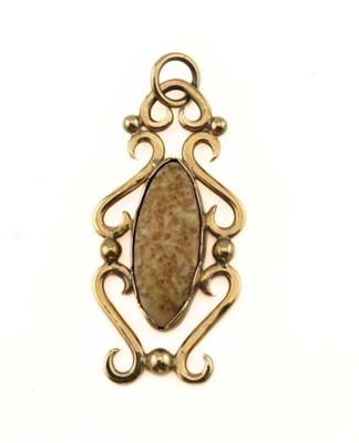 Lot 396 - A yellow paste scrolling pendant