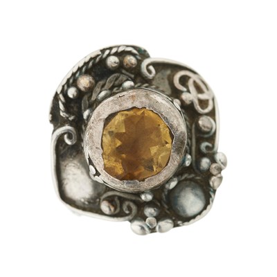 Lot 32 - An Arts & Crafts silver citrine ring