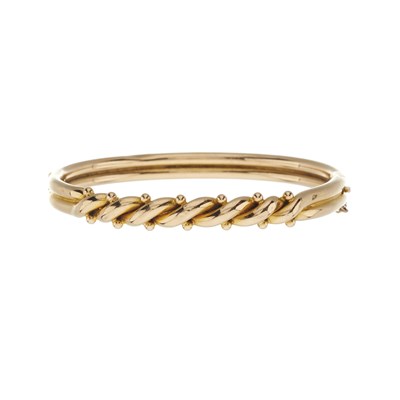 Lot 22 - An early 20th century 15ct gold twist and bead hinged bangle