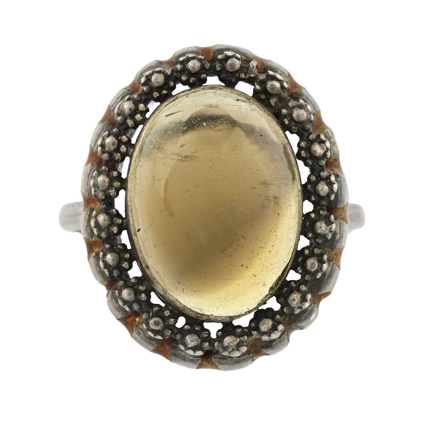 Lot 8 - An Arts & Crafts silver smoky quartz and brown enamel ring, attributed to Bernard Instone