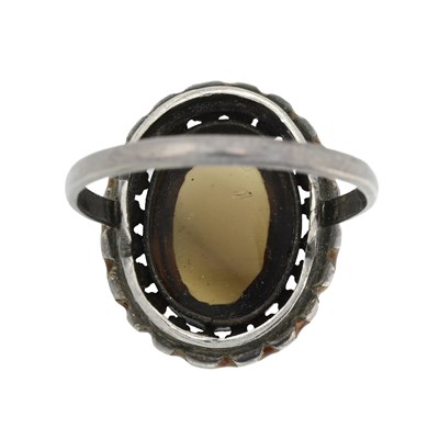 Lot 8 - An Arts & Crafts silver smoky quartz and brown enamel ring, attributed to Bernard Instone