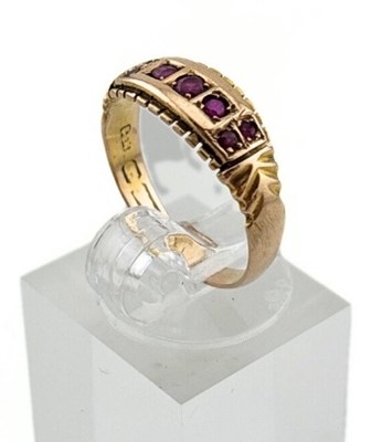 Lot 424 - An early 20th century 15ct gold ruby band ring