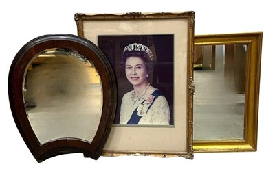 Lot 745 - A horseshoe-shaped mirror, bevelled glass with...