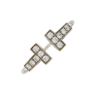 Lot 188 - Tiffany & Co., an 18ct gold brilliant-cut diamond Tiffany T ring