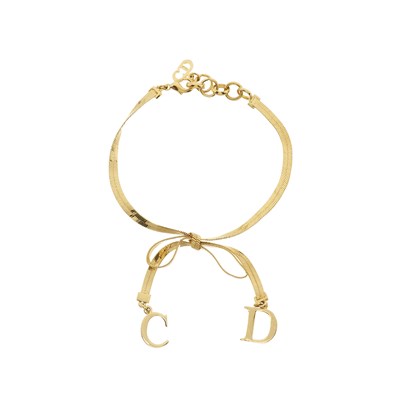 Lot 372 - Christian Dior, a CD bow choker necklace w/ matching bracelet.