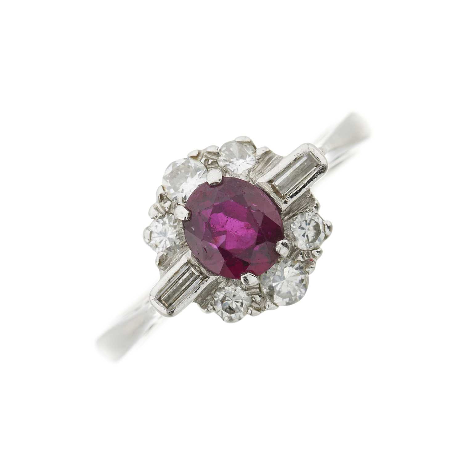 Lot 104 - A ruby and diamond cluster ring