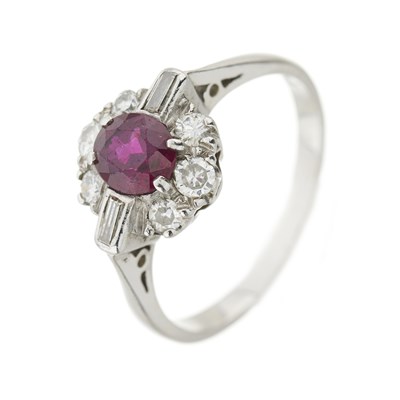 Lot 104 - A ruby and diamond cluster ring