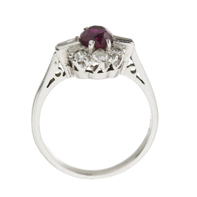 Lot 104 - A ruby and diamond cluster ring