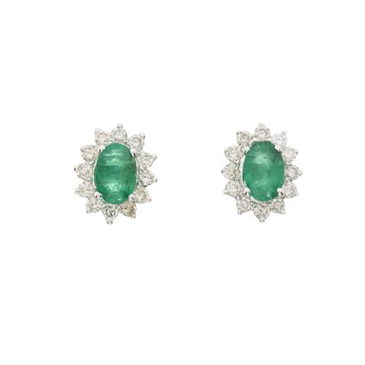 Lot 166 - A pair of emerald and brilliant-cut diamond cluster stud earrings