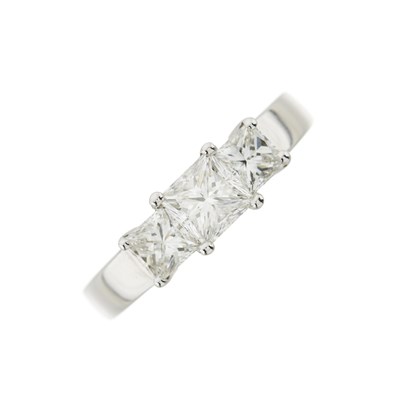 Lot 209 - A princess-cut diamond three-stone ring
