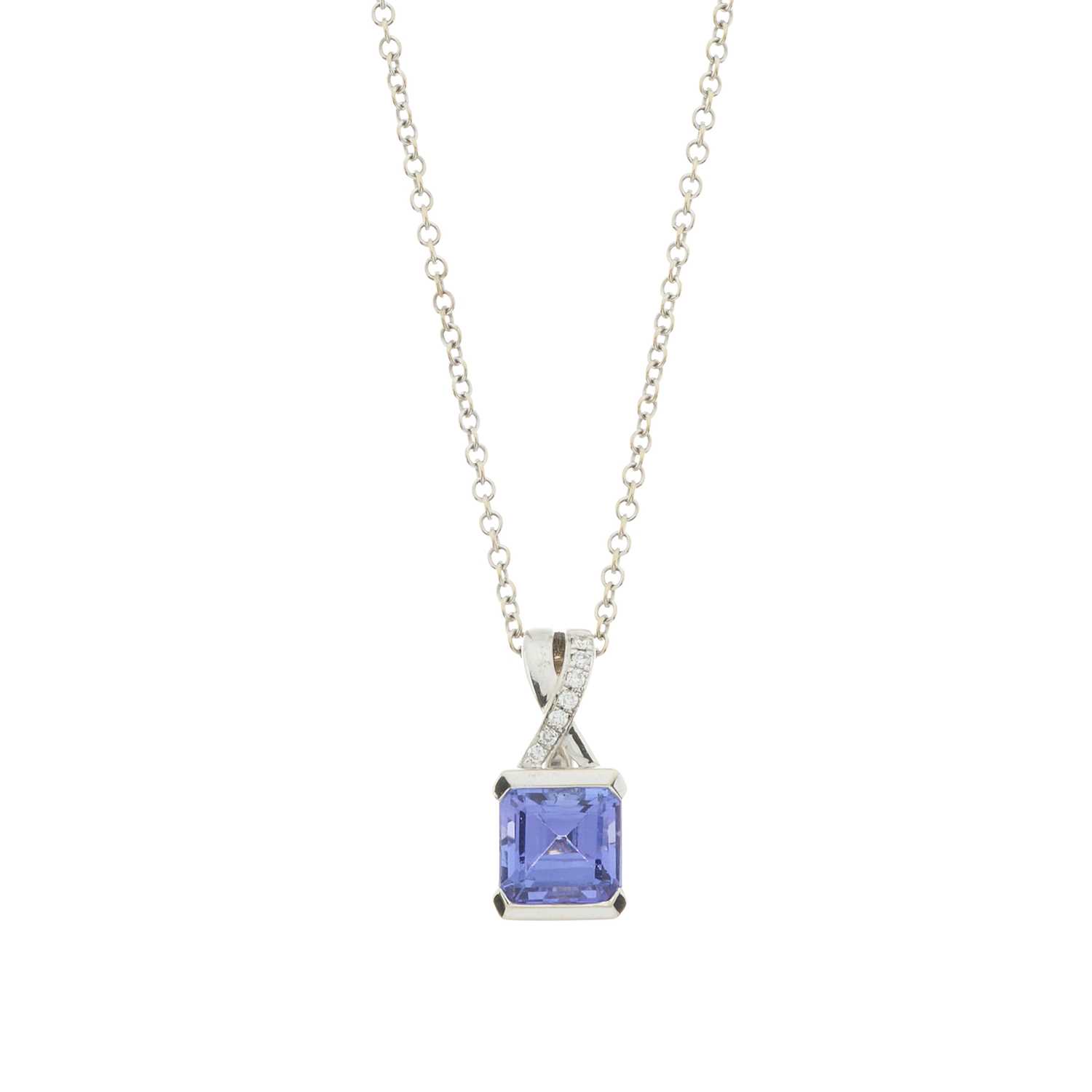 Lot 99 - A tanzanite and brilliant-cut diamond pendant and chain
