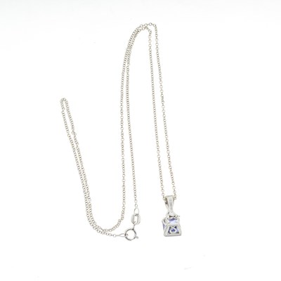 Lot 99 - A tanzanite and brilliant-cut diamond pendant and chain