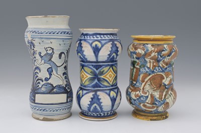 Lot 741 - Three maiolica faience glazed albarello jars,...