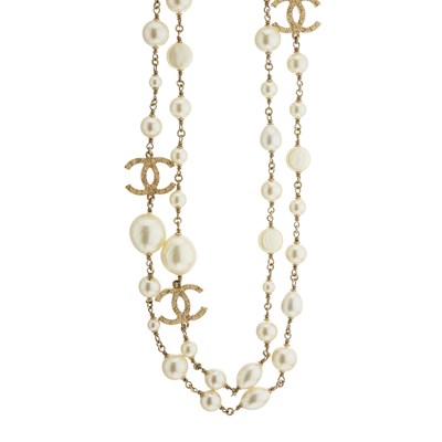 Lot 360 - Chanel, a long faux pearl and CC necklace.
