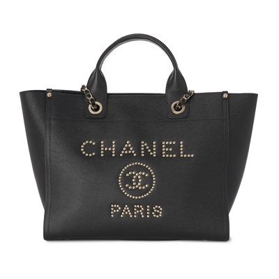 Lot 319 - Chanel, a Deauville handbag.