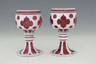 Lot 701 - A pair of Bohemian ruby and opaque cased flash...