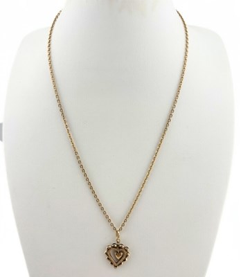 Lot 506 - A heart shape pendant and chain