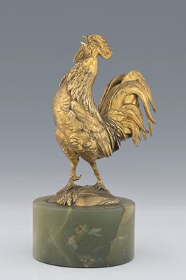 Lot 128 - A gilt bronze and onyx figure of a cockerel,...