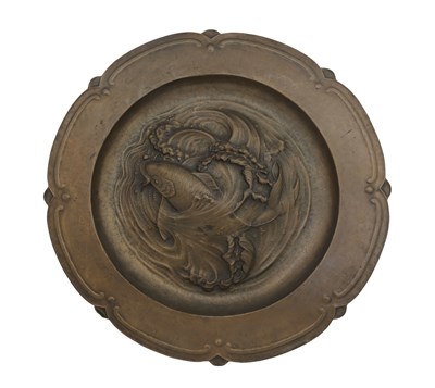 Lot 644 - A large patinated copper wall charger,...