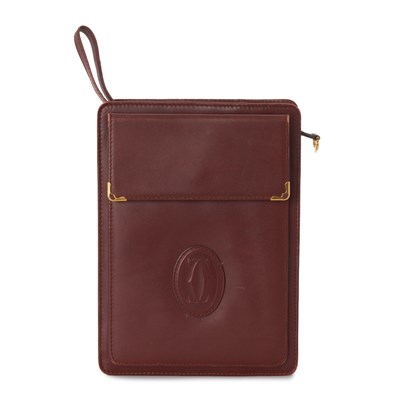 Lot 278 - Cartier, a vintage Bordeaux clutch bag.