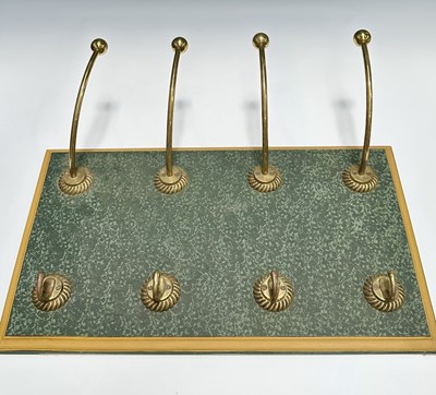Lot 268 - A coat and hat rack on a moulded wooden back...