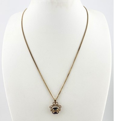 Lot 507 - A 9ct gold sapphire, garnet and amethyst swivel fob pendant and chain