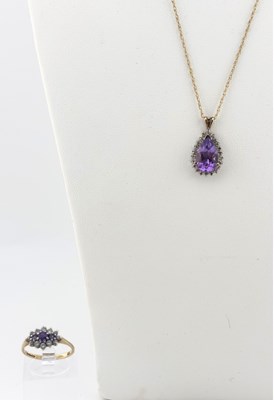 Lot 517 - A 9ct gold amethyst and cubic zirconia ring, and an amethyst and diamond pendant with chain