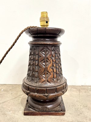 Lot 192 - A carved wooden architectural lamp base with a...