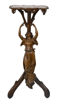 Lot 675 - A Continental Art Nouveau fruitwood figural...
