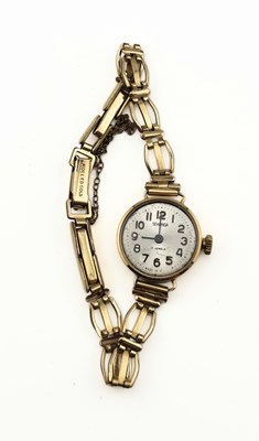 Lot 496 - Sekonda, a 9ct gold ladys wrist watch, with rolled gold expandable strap