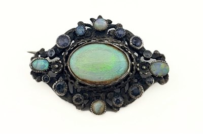 Lot 452 - A 19ct century silver opal and sapphire foliate brooch