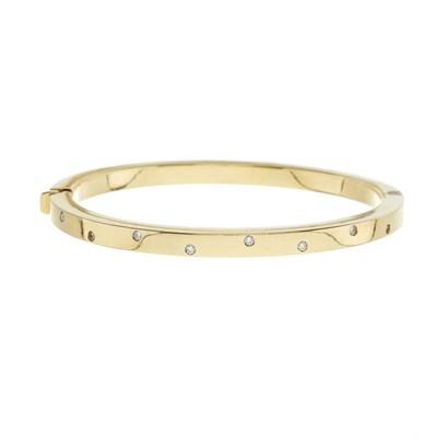 Lot 216 - An 18ct gold brilliant-cut diamond hinged bangle