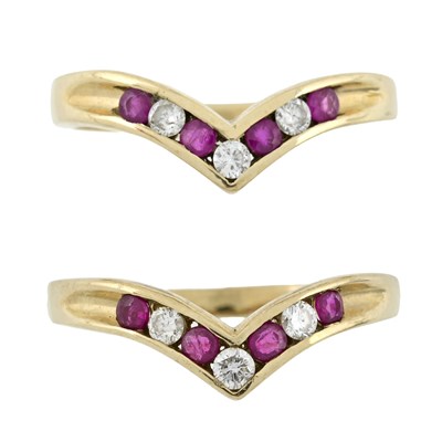 Lot 483 - Two 9ct gold ruby and brilliant-cut diamond chevron rings