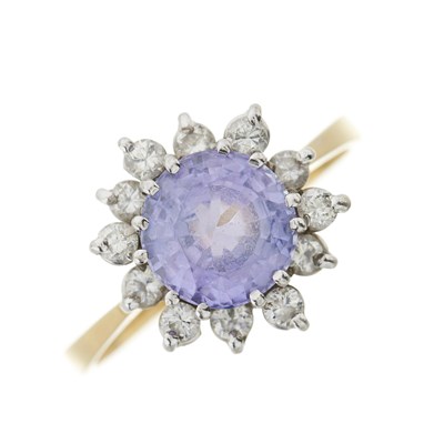 Lot 124 - An 18ct gold tanzanite and brilliant-cut diamond cluster ring