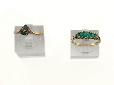 Lot 501 - Two emerald and diamond rings, one AF