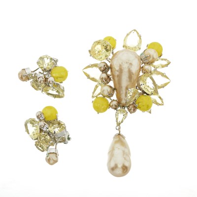 Lot 370 - Christian Dior, a pair of 1960s clip-on earrings and matching brooch.