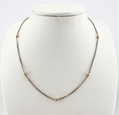 Lot 429 - A box-link and ball chain necklace