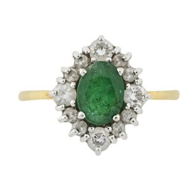 Lot 535 - An 18ct gold emerald and brilliant-cut diamond cluster ring