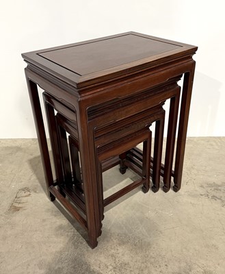 Lot 778 - A nest of four Chinese hardwood tables, the...