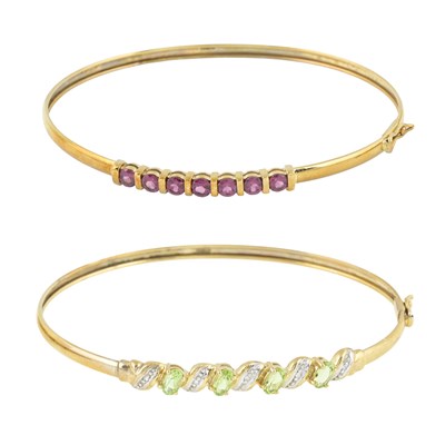 Lot 551 - Two 9ct gold gem set bangles