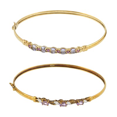 Lot 511 - Two 9ct gold gem set bangles