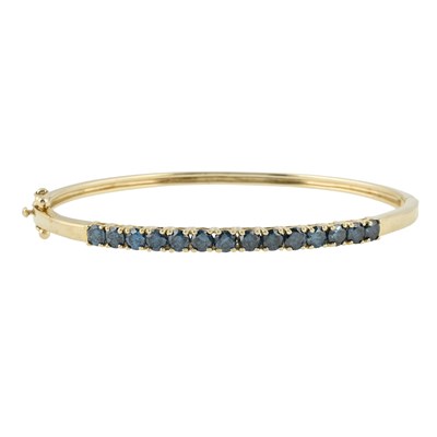 Lot 556 - A 9ct gold treated blue diamond hinged bangle