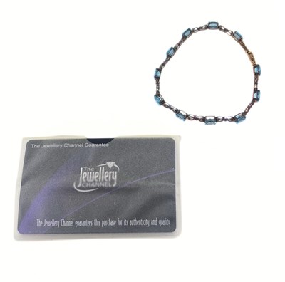 Lot 514 - A 9ct gold blue topaz bracelet
