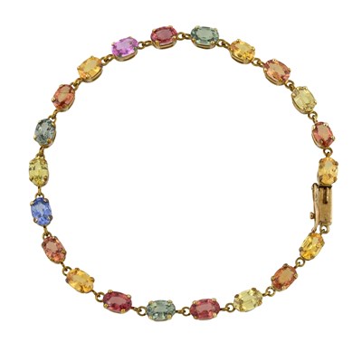 Lot 513 - A 9ct gold multi-hue sapphire line bracelet