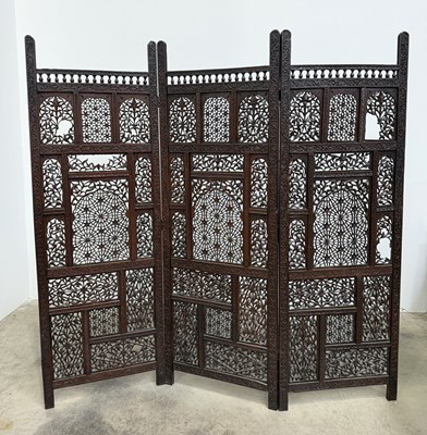 Lot 765 - A Syrian hard wood three panel screen, with...
