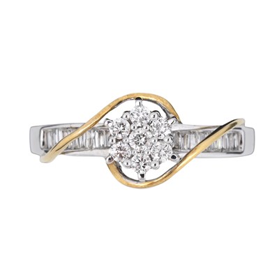 Lot 75 - A bi-colour 18ct gold brilliant-cut and baguette-cut diamond cluster ring