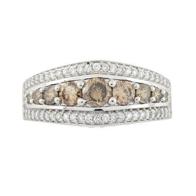 Lot 576 - A brilliant-cut diamond and brown diamond dress ring