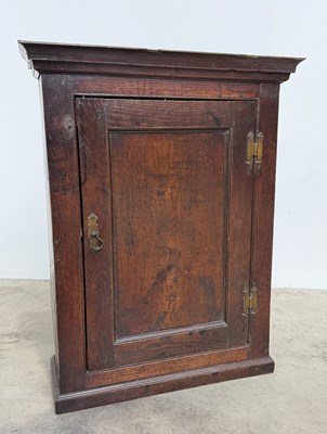 Lot 775 - An 18th century small rustic oak wall cupboard...