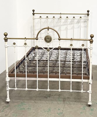 Lot 786 - A cast iron and brass bed stead: a white...