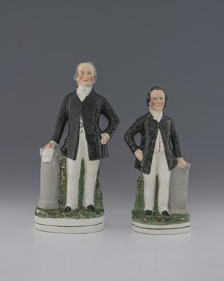 Lot 780 - A matched pair of Staffordshire flatback...
